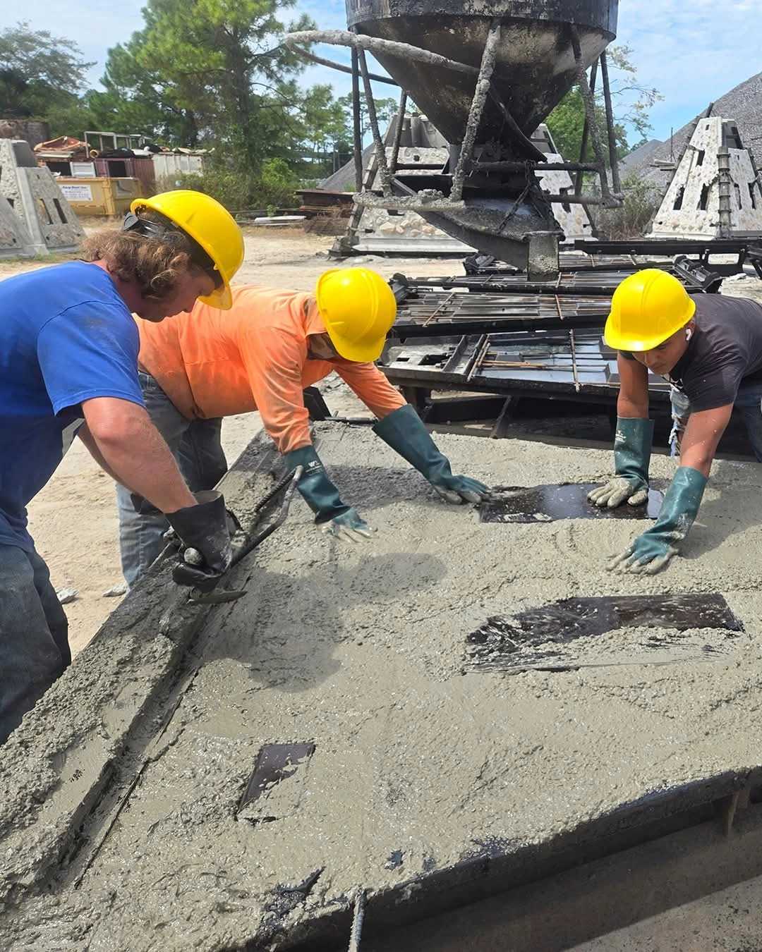 The team hand-finishing marine-grade concrete on a memorial reef at the casting yard.